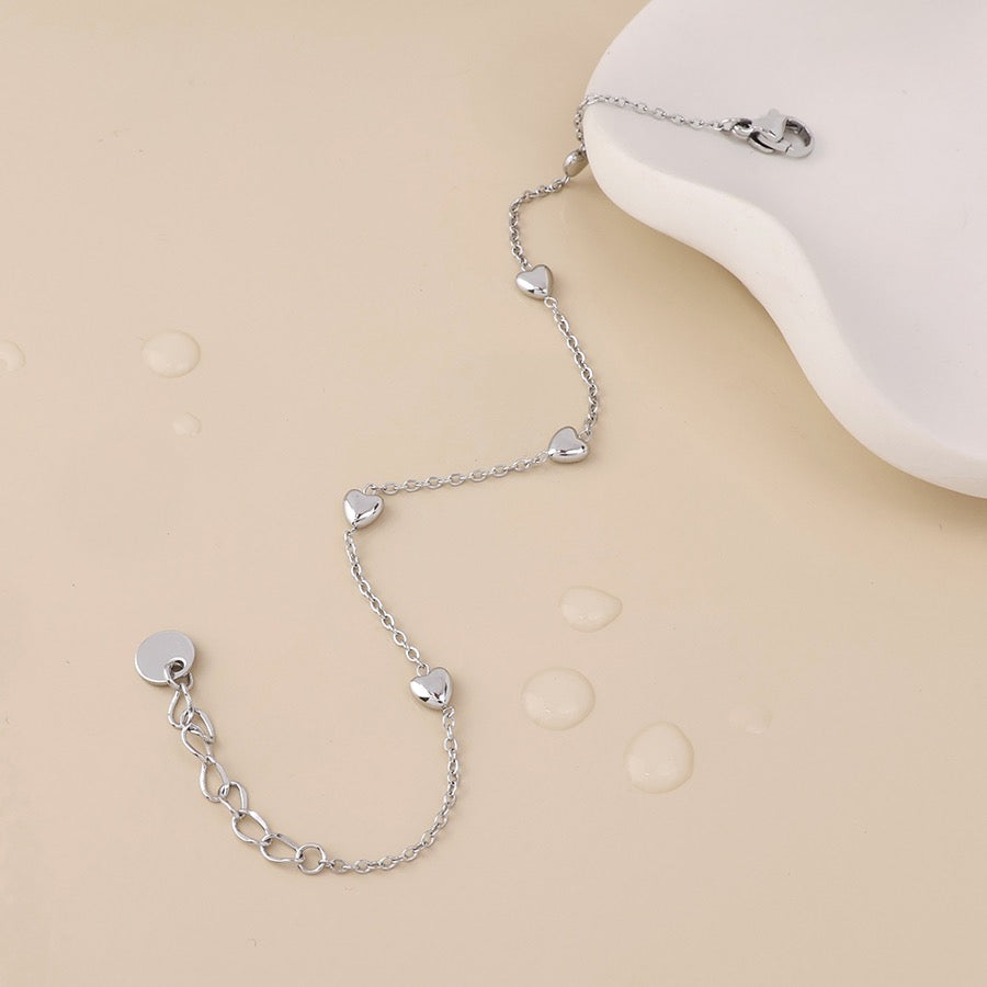 POM WATERPROOF - Whisper Stainless Steel Tiny Hearts Station Chain Bracelet - Silver