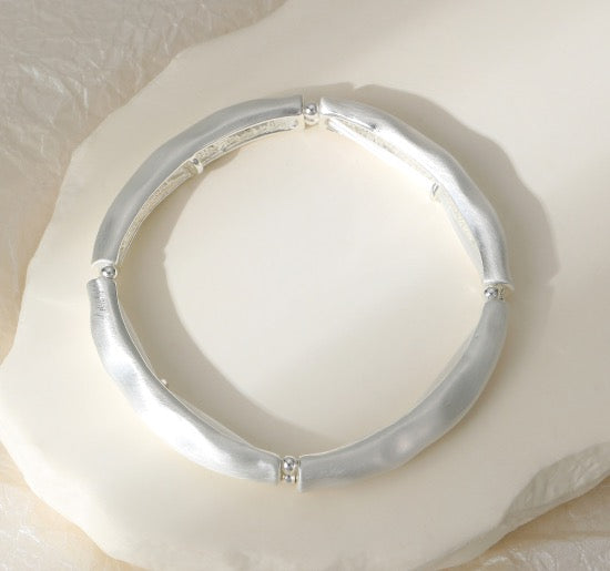 Gracee Jewellery - Matt Silver Hammered Bangle Style- Stretch Bracelet
