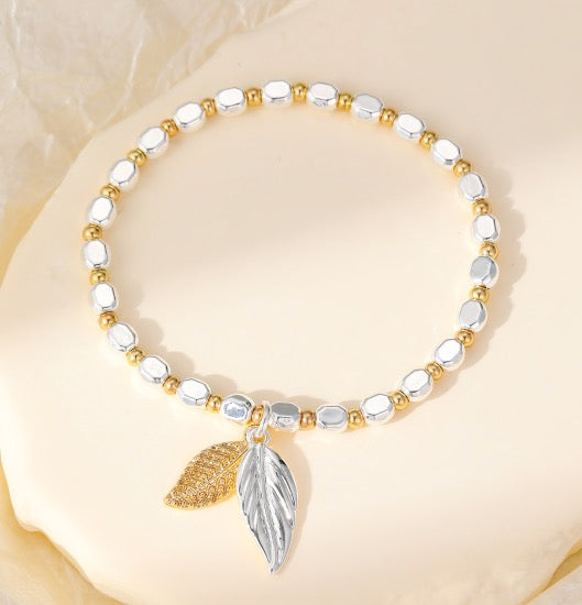 Gracee Jewellery - Gold &amp; Silver Double Leaf Charm- Stretch Bracelet