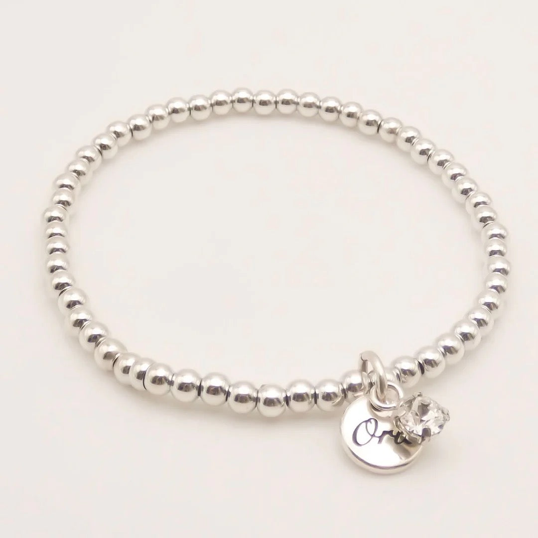 Orli Classic Silver Crystal Diamante Charm Stretch Beaded Bracelet