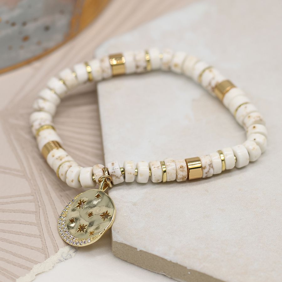 POM White Semi Precious Bead Stretch Bracelet with Gold Cut out Disc Charm