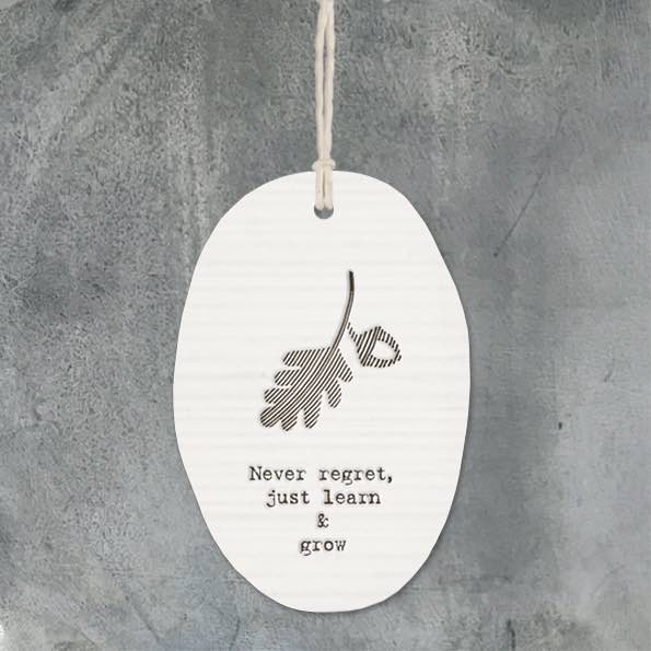 East of India Porcelain Oval Hanger -Never Regret